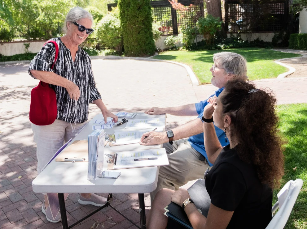 Ed Miller Checking Guests In at Senator Jacky Rosen Event August 12, 2023